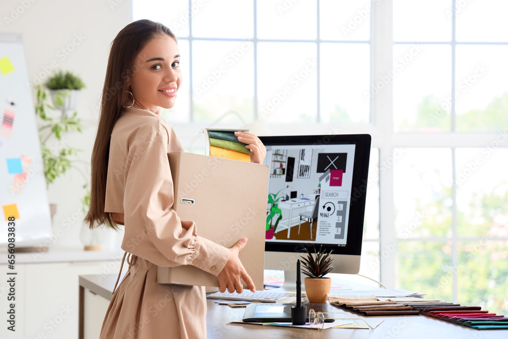 Female interior designer working with fabric samples in office