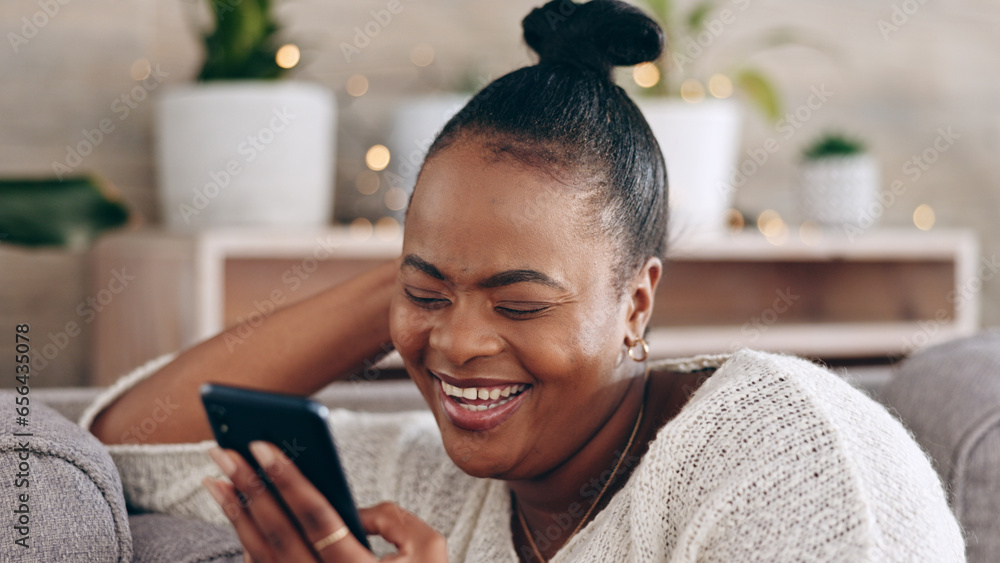 Funny, black woman and using phone with smile in home or social media, mobile app and communication online. internet, meme or person on couch streaming video or comedy on cellphone in living room