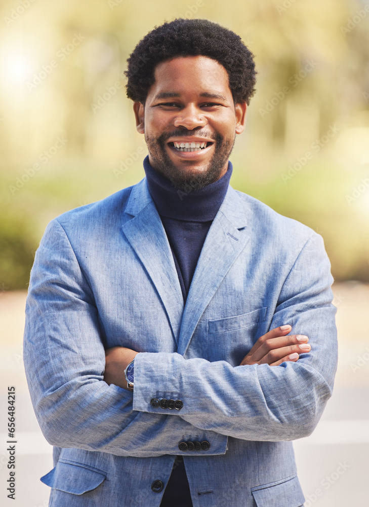 Happy, portrait and a black man with arms crossed in the city with corporate confidence. Smile, young and an African person, employee or lawyer with pride in career and businessman for urban work