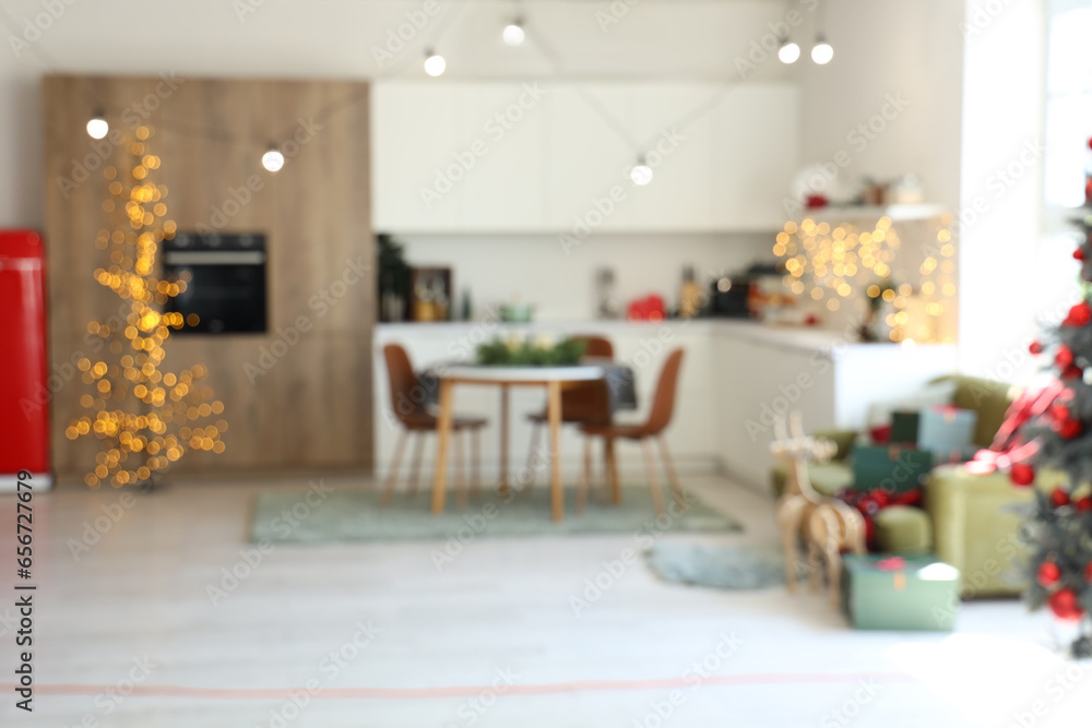 Blurred view of festive kitchen with Christmas decorations