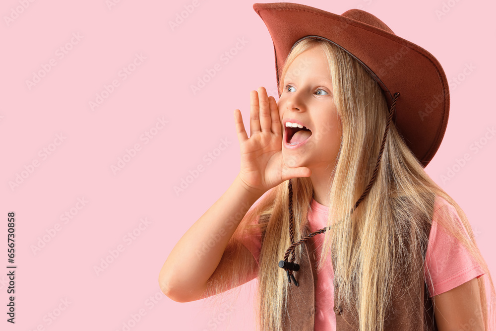 Little cowgirl shouting on pink background, closeup