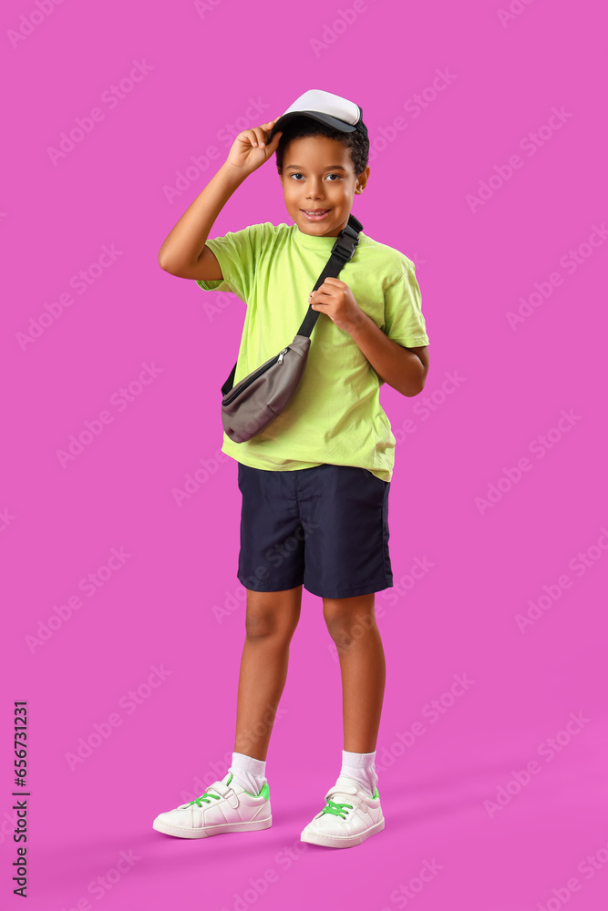 African-American little boy on purple background