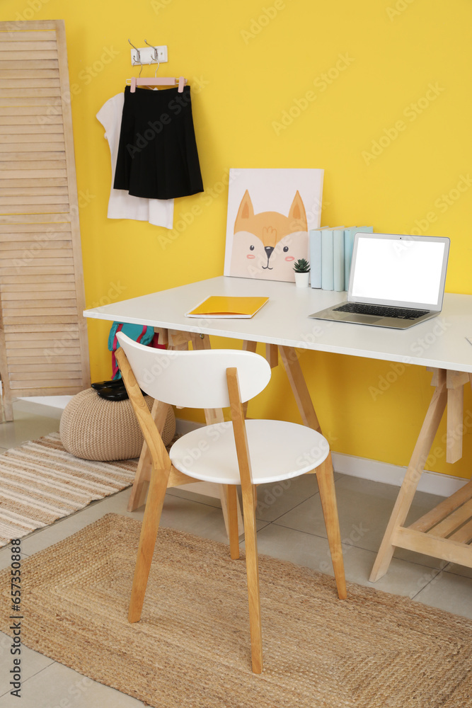 Interior of modern room with workplace and stylish school uniform