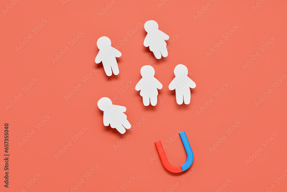 Magnet attracting group of customers on red background. Marketing concept