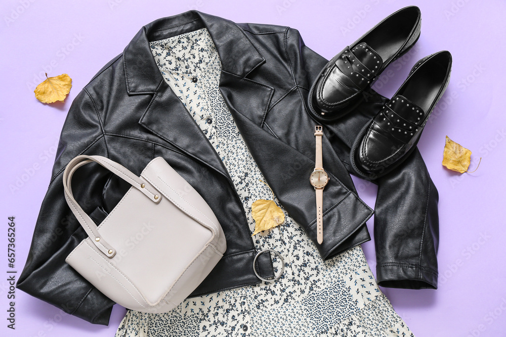 Composition with stylish female clothes, shoes and accessories on lilac background