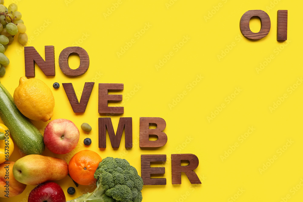 Frame made of fresh vegetables and fruits with date NOVEMBER 1 on yellow background. World Vegan Day concept