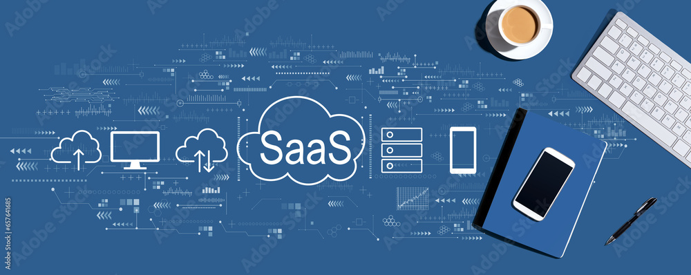 SaaS - software as a service concept with a computer keyboard and office items