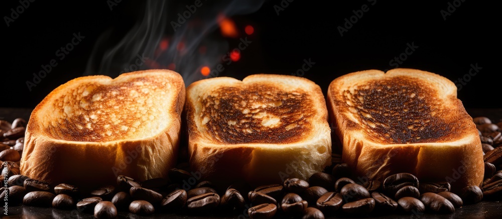 Three differently toasted coffee beans against a black backdrop