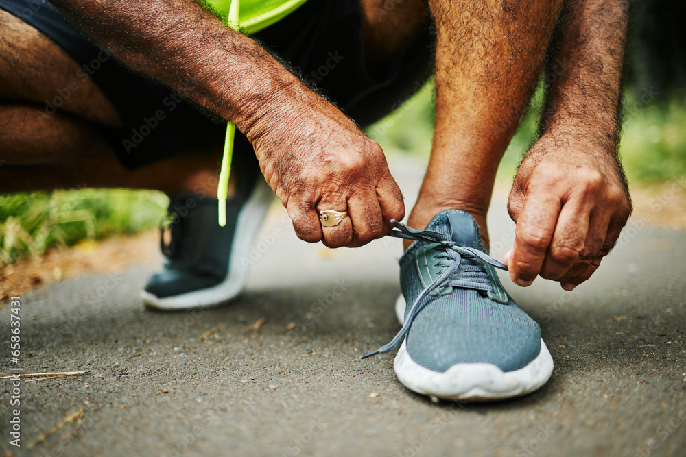 Man, tie and shoes in fitness for running, workout or outdoor exercise on road, street or asphalt. Closeup of male person, hands and tying shoe getting ready or preparation for sports, cardio or run