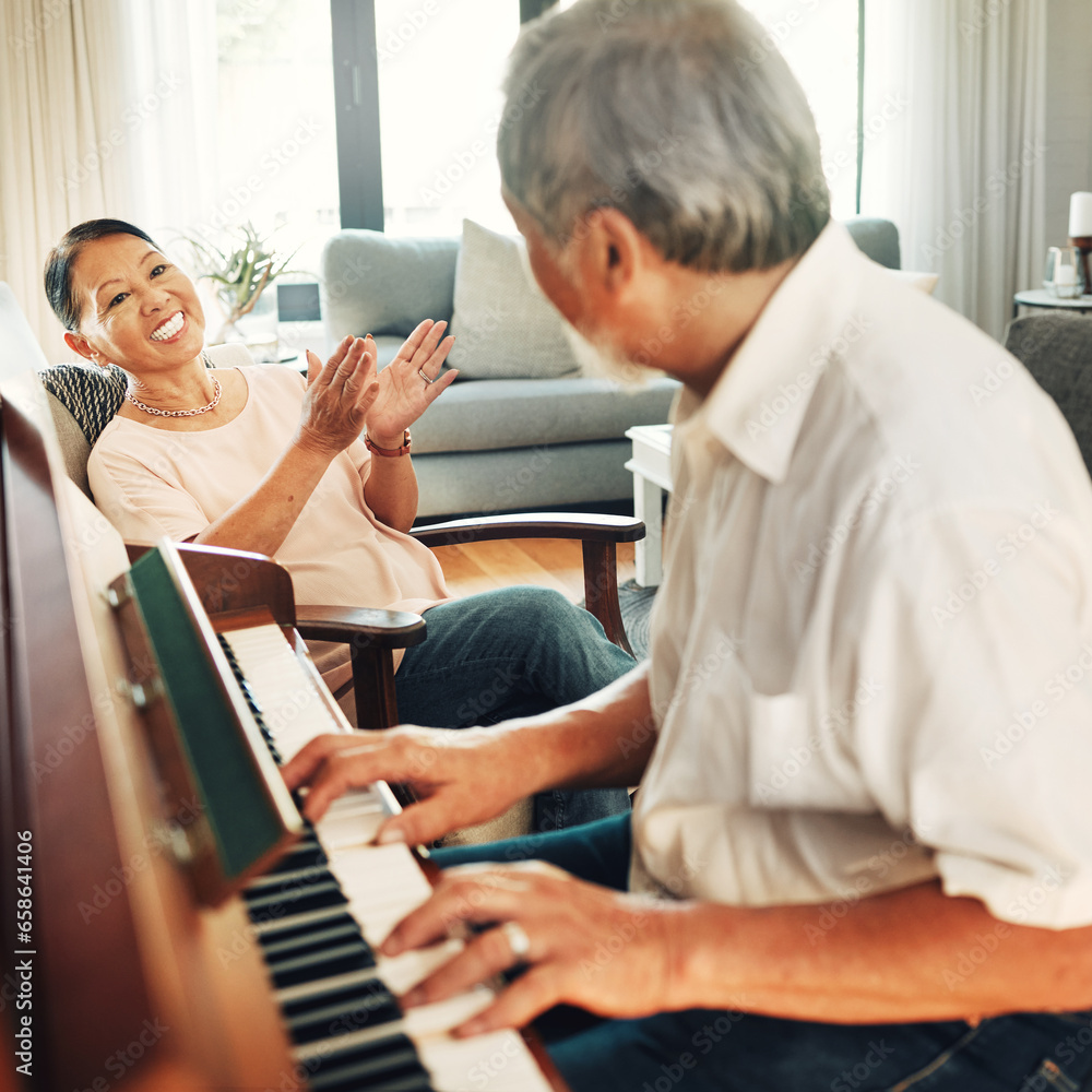 Smile, piano and senior man playing a song to his wife for music in living room with bonding or entertainment. Happy, instrument and elderly Asian couple in retirement enjoy keyboard at modern home.