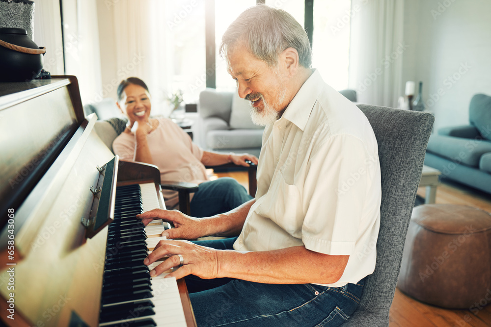 Senior man playing piano for music in living room with wife for bonding, entertainment or having fun. Happy, smile and elderly Asian couple in retirement enjoying keyboard instrument at modern home.