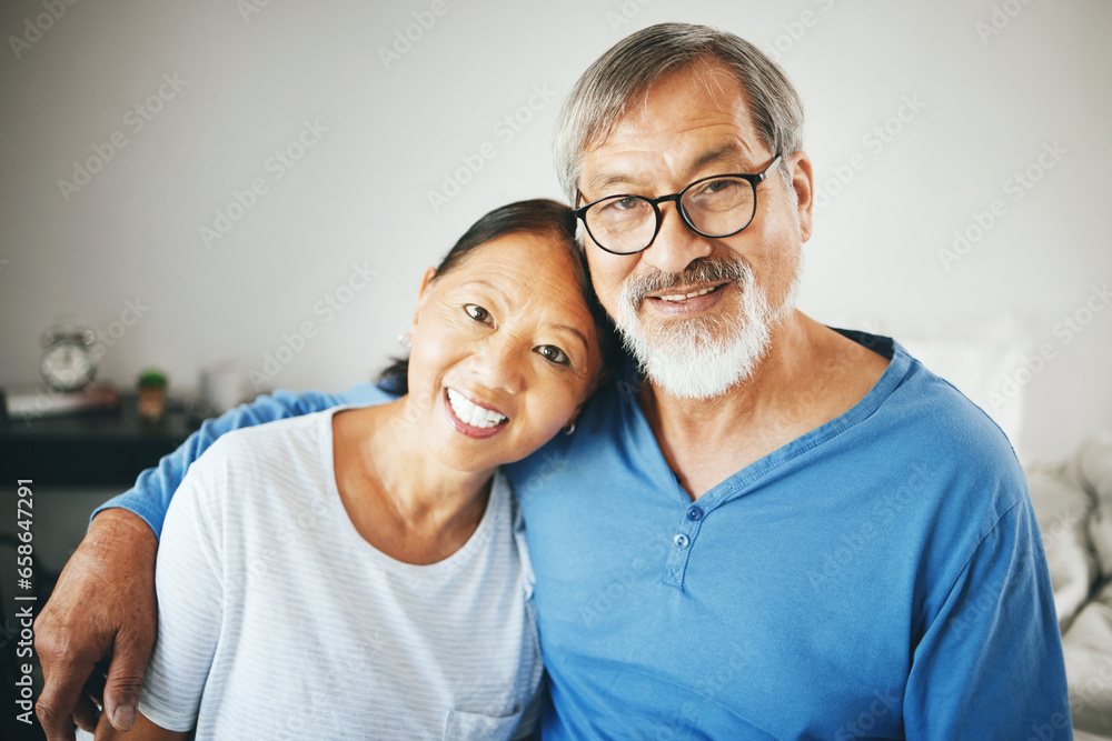 Mature, portrait or happy couple hug in home or house together to relax on holiday with bond or support. Embrace, lovers or romantic Asian man with a senior woman with love, smile or care in marriage