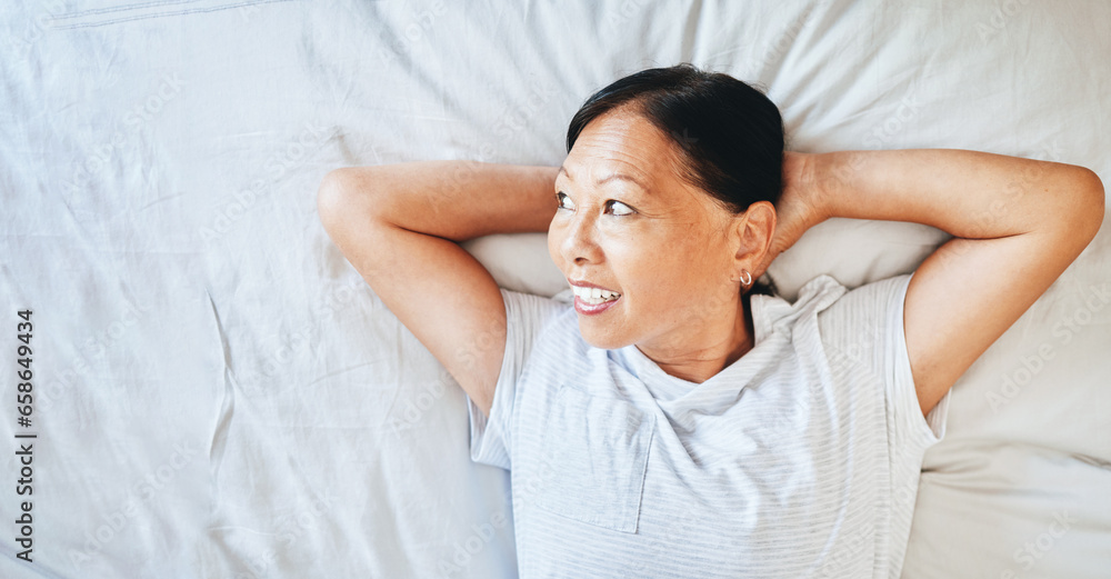 Bed, thinking and happy mature woman sleeping, tired or nap for stress relief, morning wellness or retirement rest. Top view, mockup space and Japanese person relax, daydream or smile in home bedroom