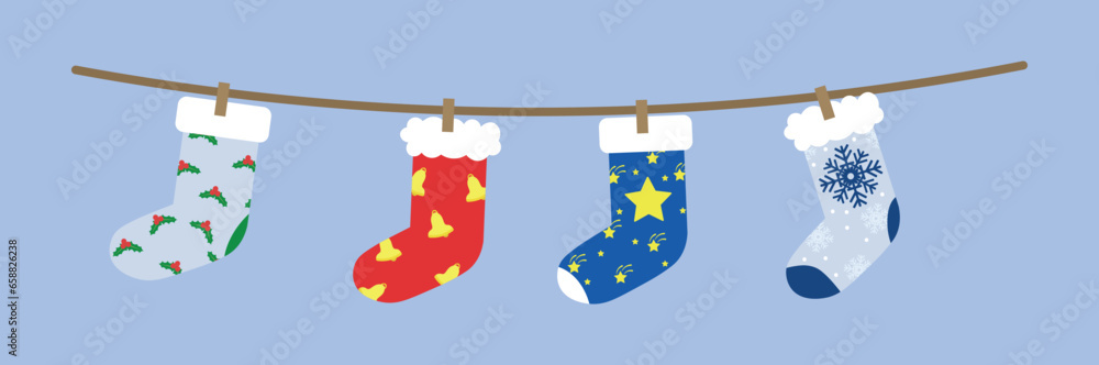 Many beautiful Christmas socks hanging on rope against color background