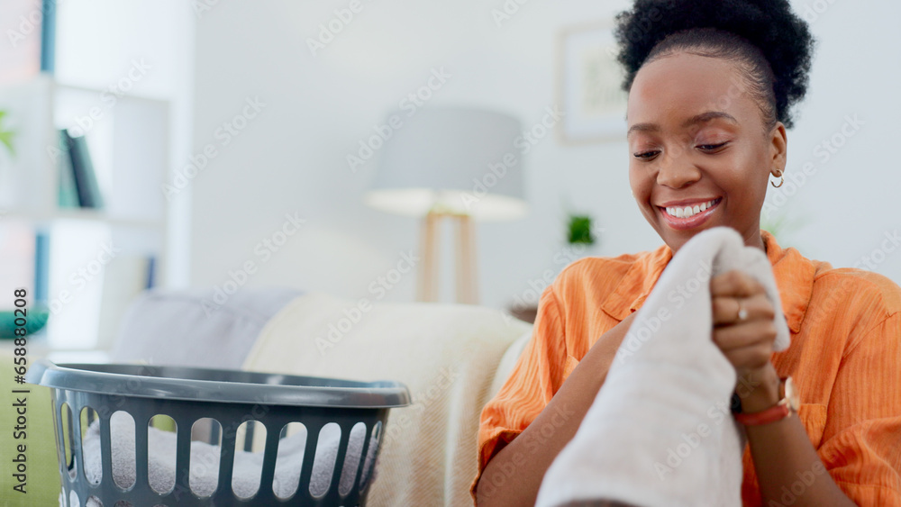 Clean, laundry and black woman with basket in home for clothes, linen or maid with spring cleaning in apartment. Washing, clothing and happy cleaner in house to wash bedding, towel or dirty fabric