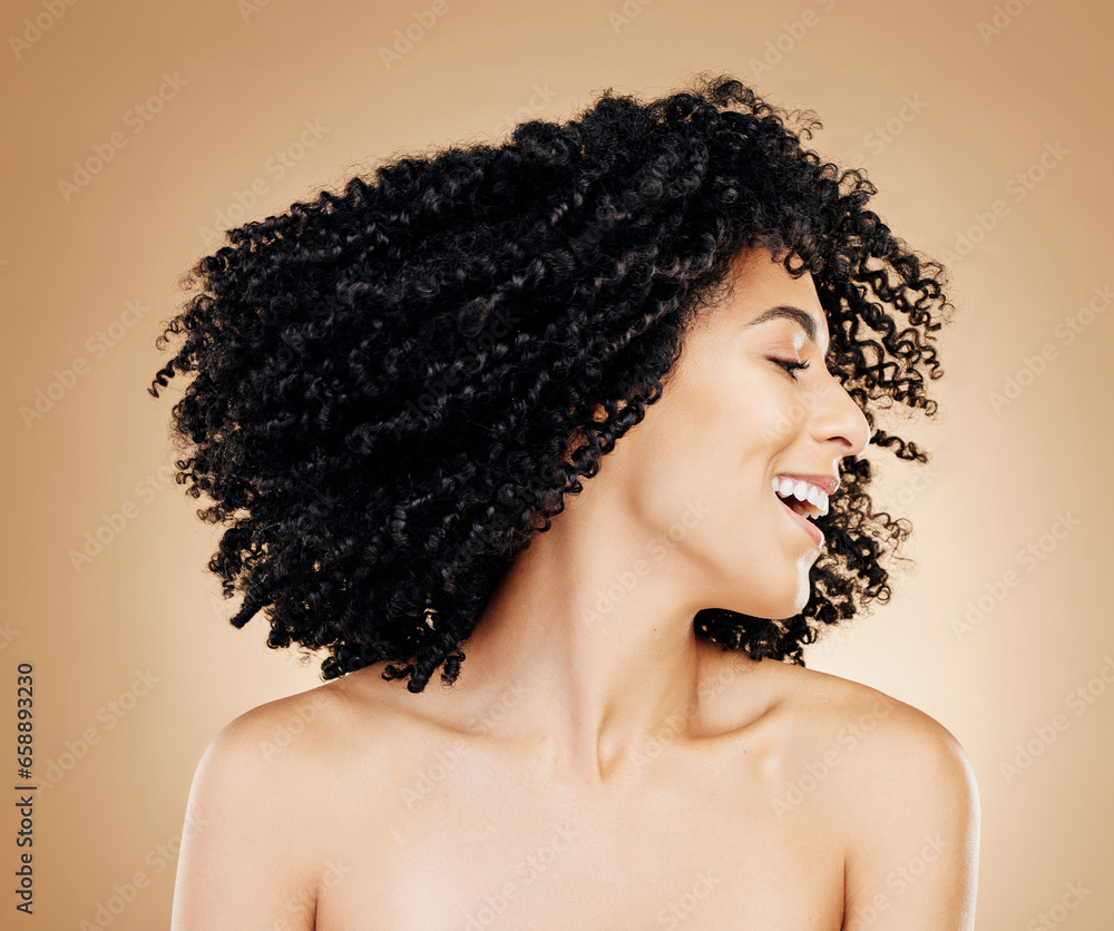 Happy woman, curly and hair shake afro for fun on studio background in healthy hairstyle growth, texture or frizz treatment. African beauty model, energy and change by shampoo transformation results