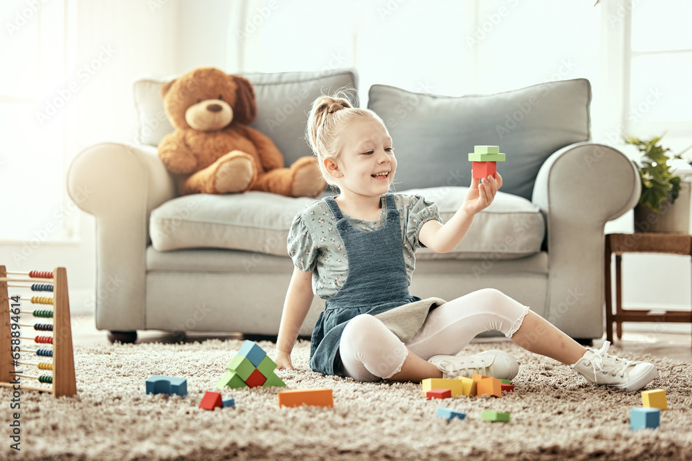 Child, playing and building blocks on living room floor, home and montessori style for fun, development and game. Colourful toys, learning and creativity for educational activity, relax and happiness