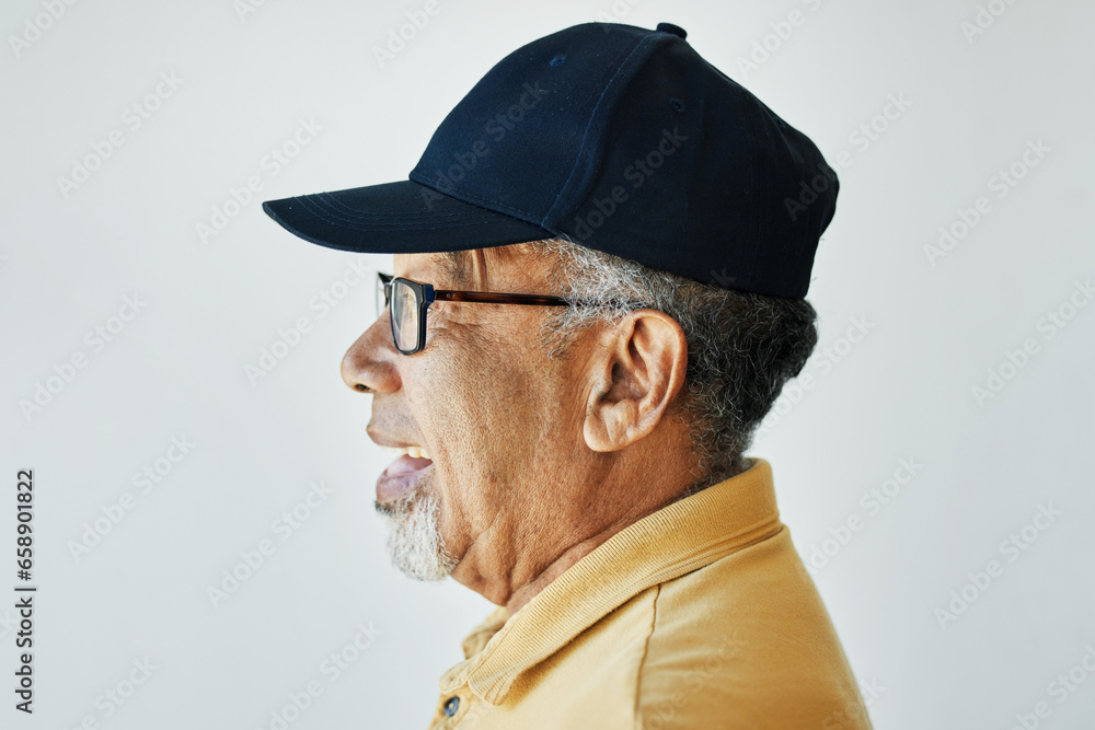 Smile, senior and side profile of a man on a studio background for fashion, relax or retirement. Happy, looking and an elderly person on a wall or backdrop for thinking, idea or stylish with clothes