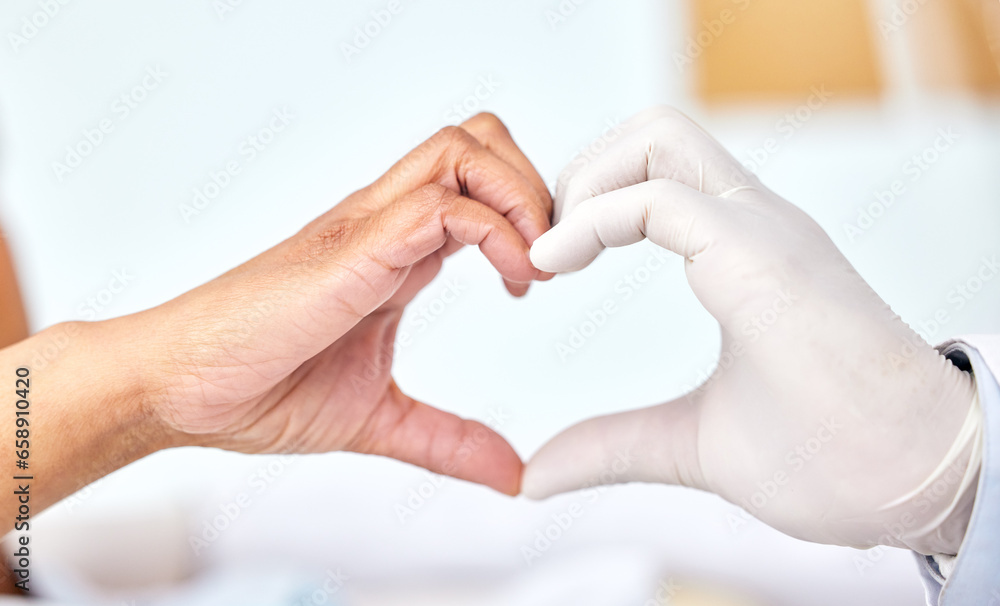 Healthcare, cardiology or heart hands with a doctor and patient closeup in a hospital for love or support. Medical, health or trust with a medicine professional and resident in a clinic for wellness