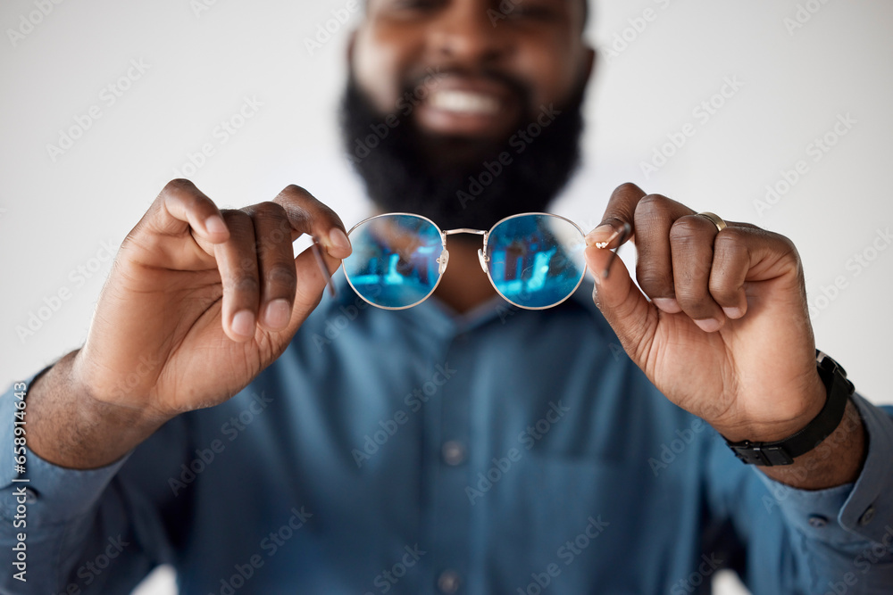 Optometry, closeup and a black man showing glasses for healthcare, consulting or an exam. Lens, happy and an African person holding prescription eyewear to check the frame for vision or eye care