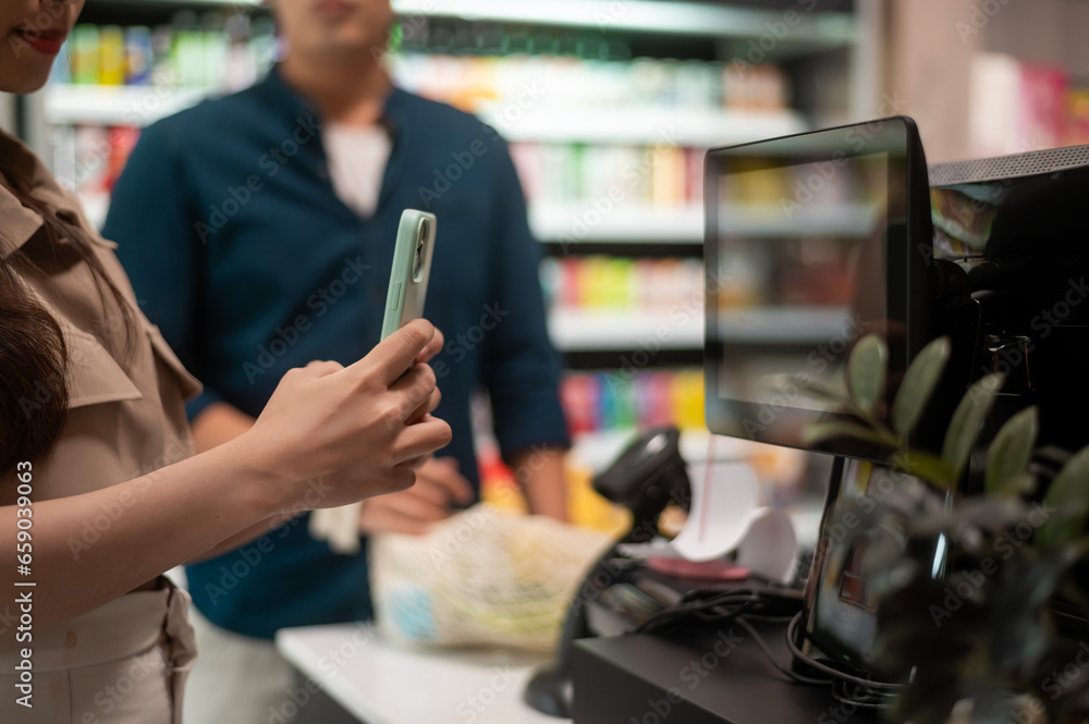 An Asian couple shopping in supermarket , concept of city life lifestyle