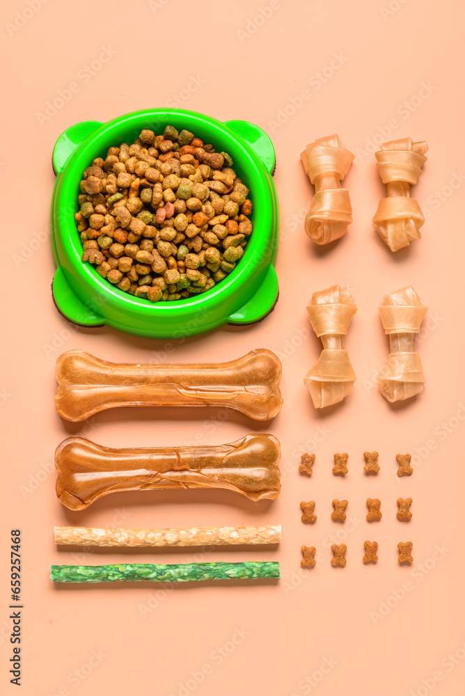 Composition with different dog treats on color background