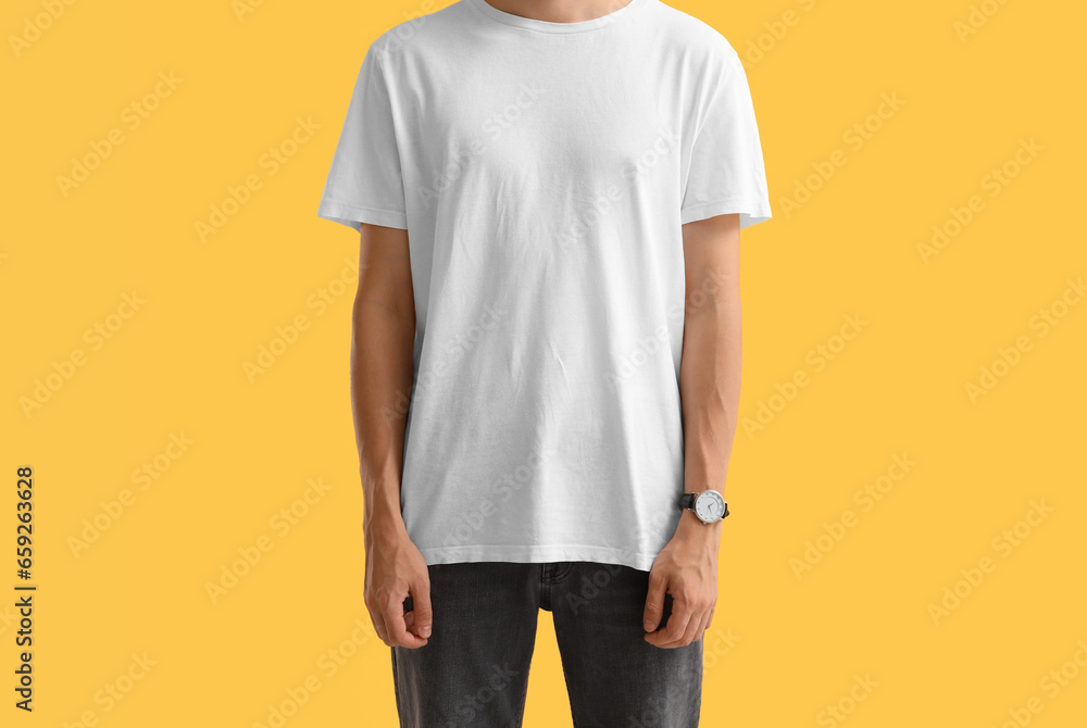 Man in stylish t-shirt on orange background