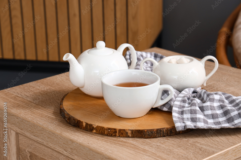 Tea set on table in living room, closeup