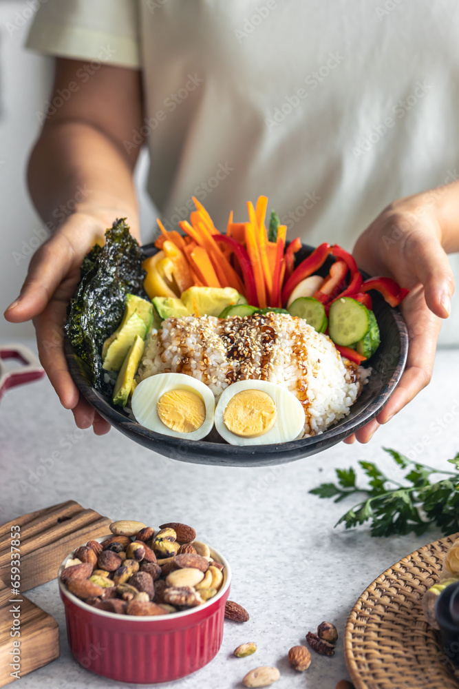 Homemade bowl with rice, vegetables and eggs.