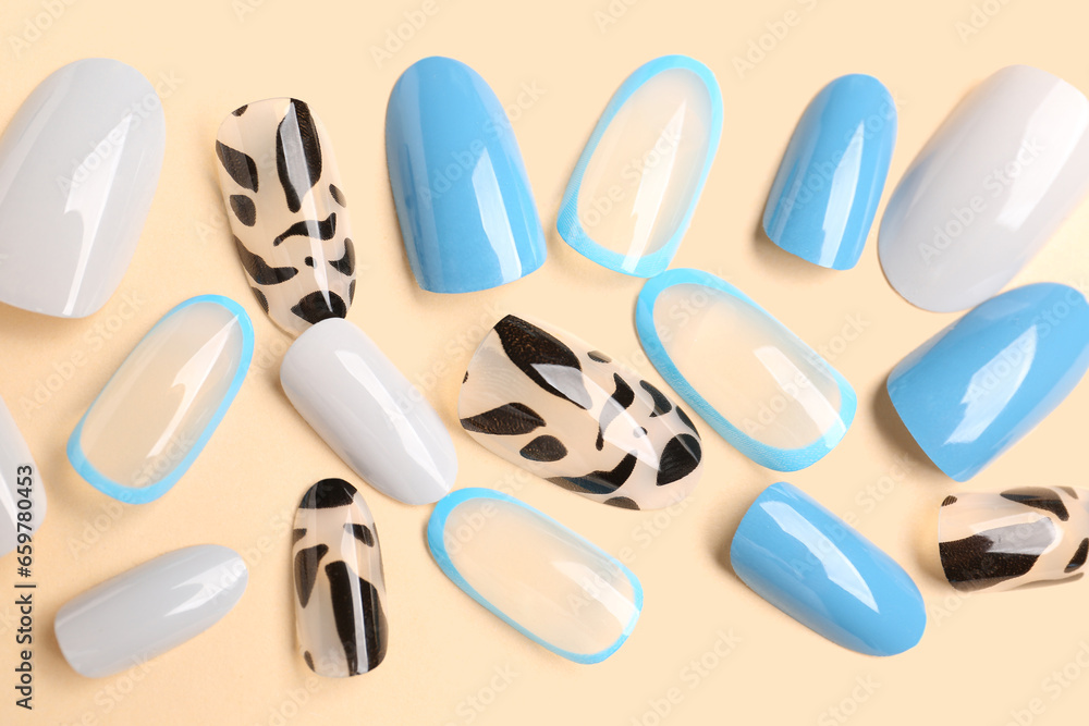 Press-on nails on beige background