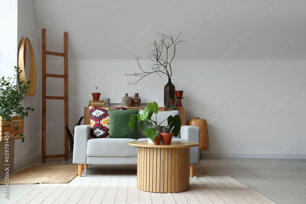 Interior of living room with coffee table and sofa