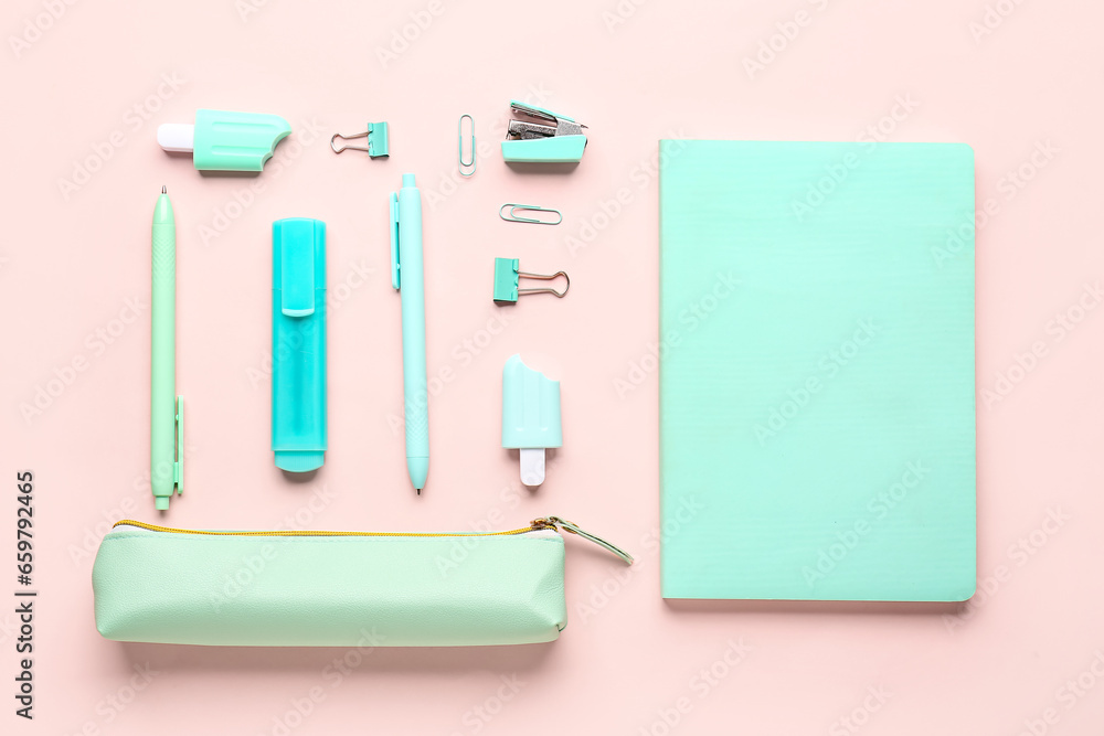 Stylish pencil case with school stationery on pink background