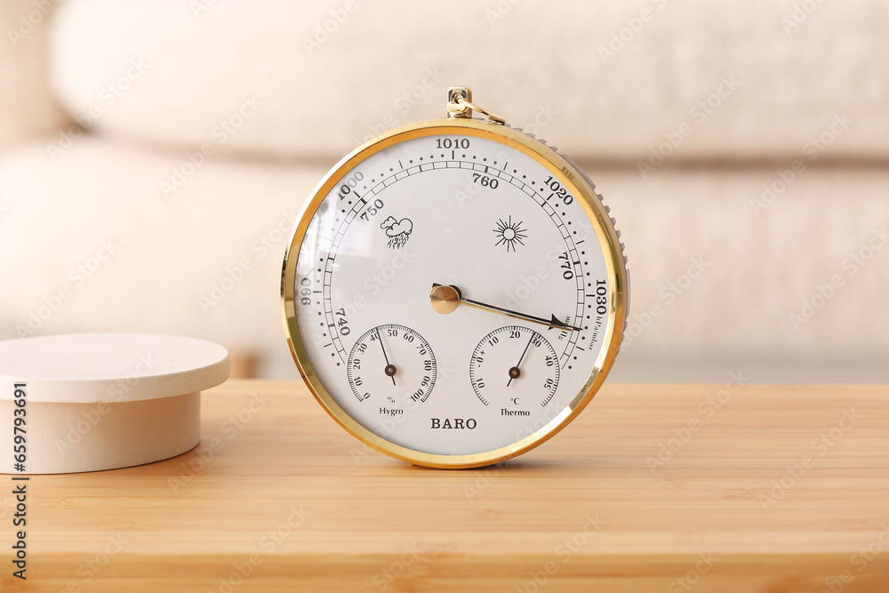 Aneroid barometer on table in room, closeup