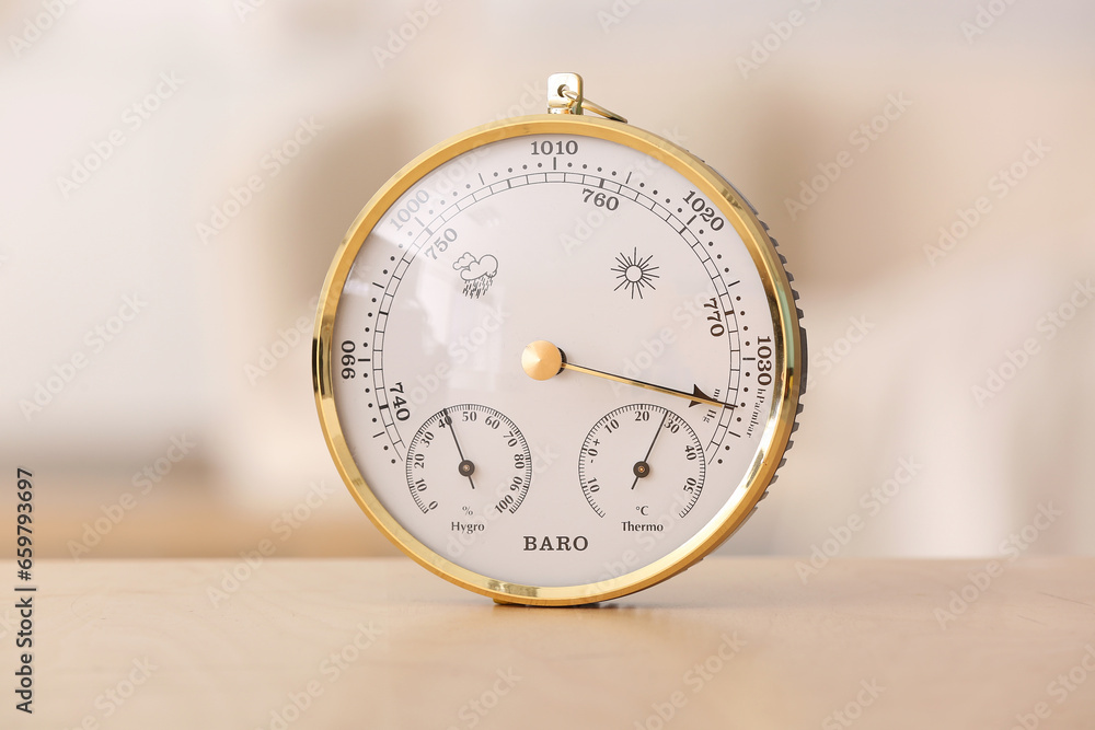 Aneroid barometer on table in room, closeup