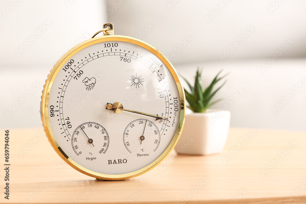 Aneroid barometer on table in room, closeup