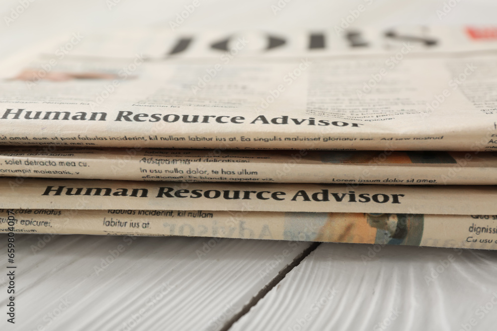 Morning newspapers on white wooden background