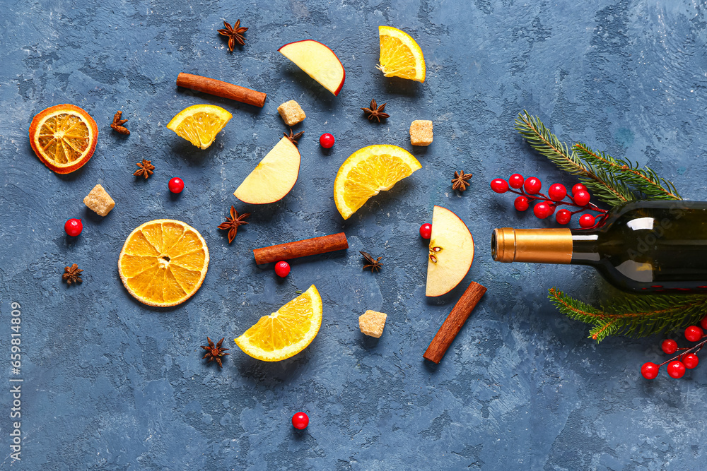 Bottle of wine and different ingredients on blue background