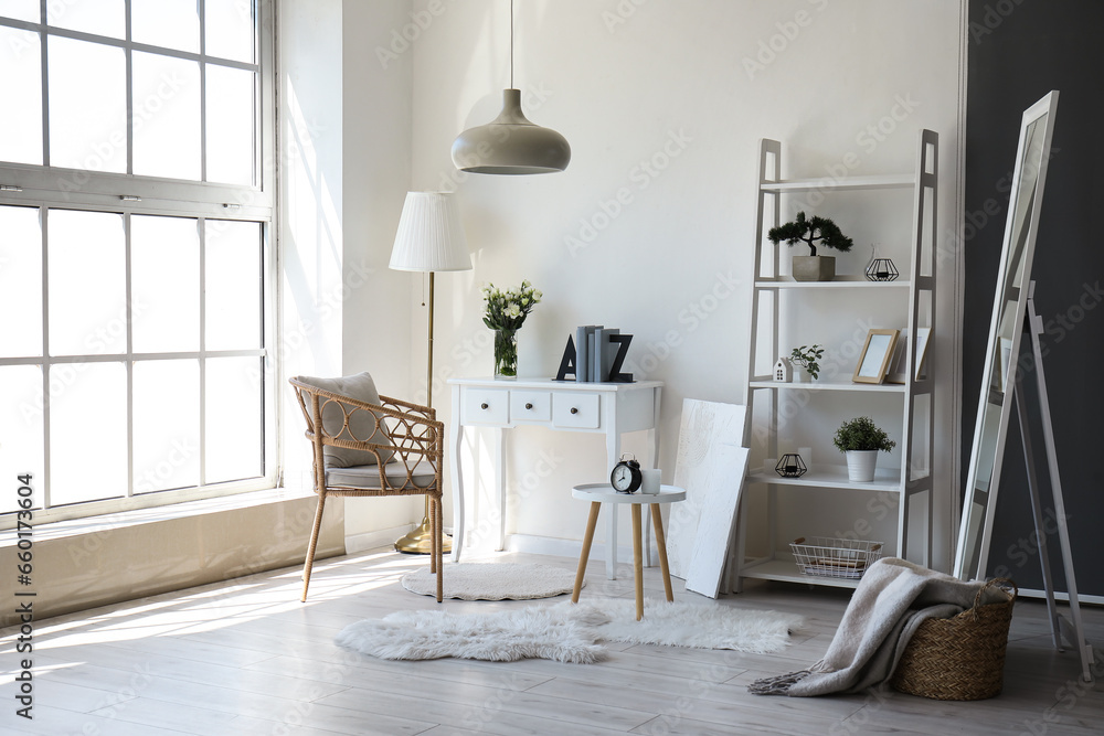 interior of living room with tables, armchair and shelving unit