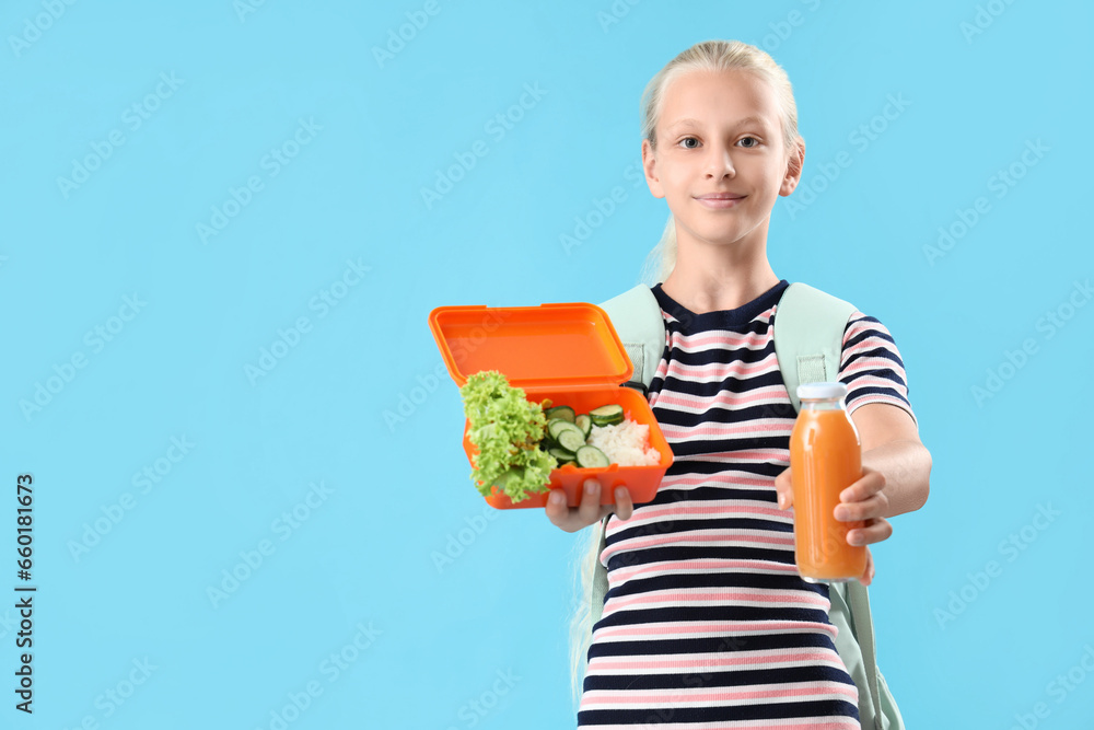 Girl with backpack, lunchbox and bottle of juice on blue background