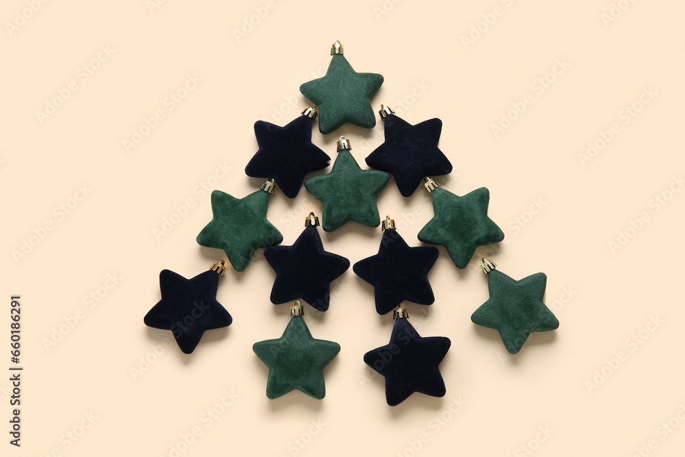 Christmas tree made of stars on beige background