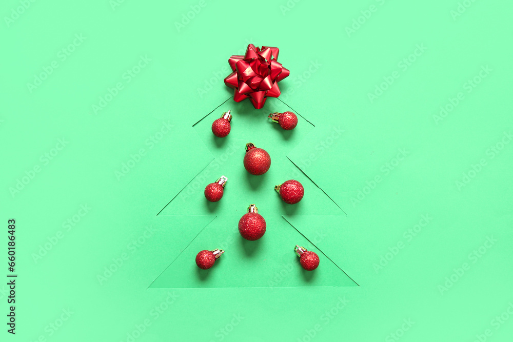 Cut green paper in shape of Christmas tree with balls and bow