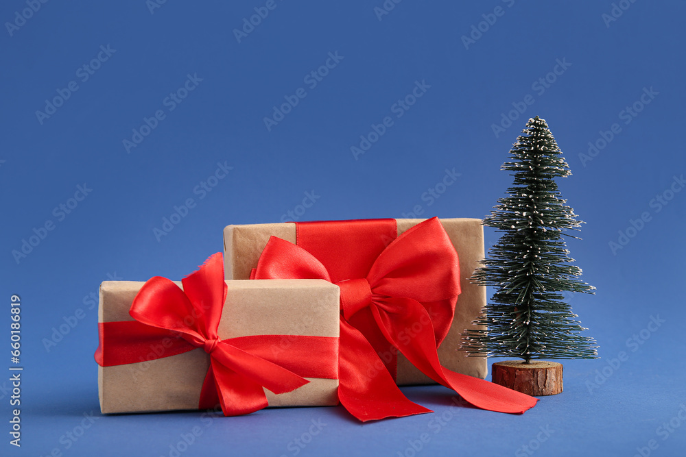 Christmas tree and gift boxes on blue background