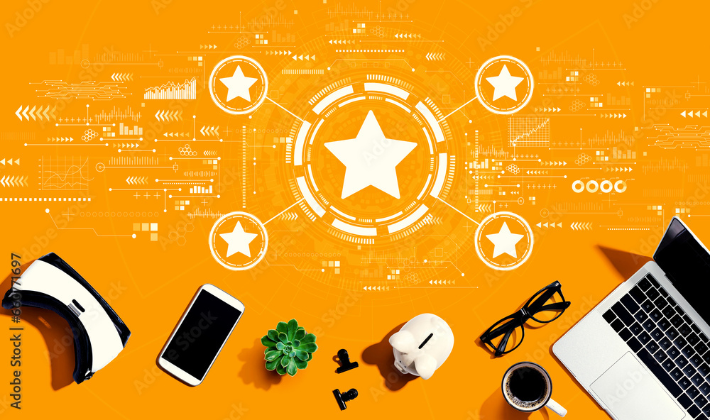 Rating star concept with electronic gadgets and office supplies - flat lay