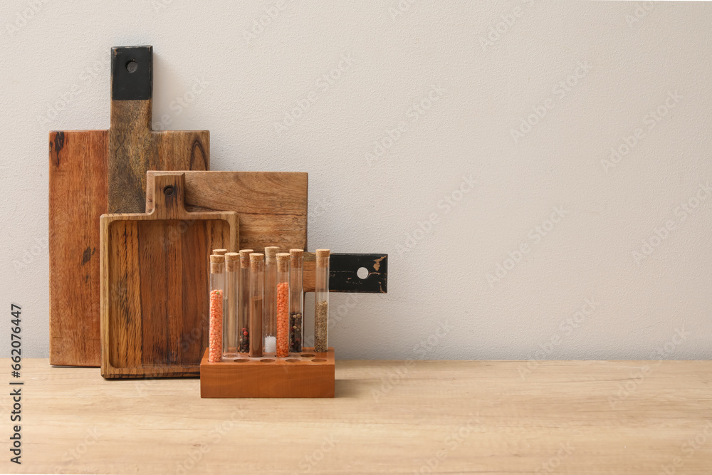 Wooden kitchen counter with cutting boards and condiments