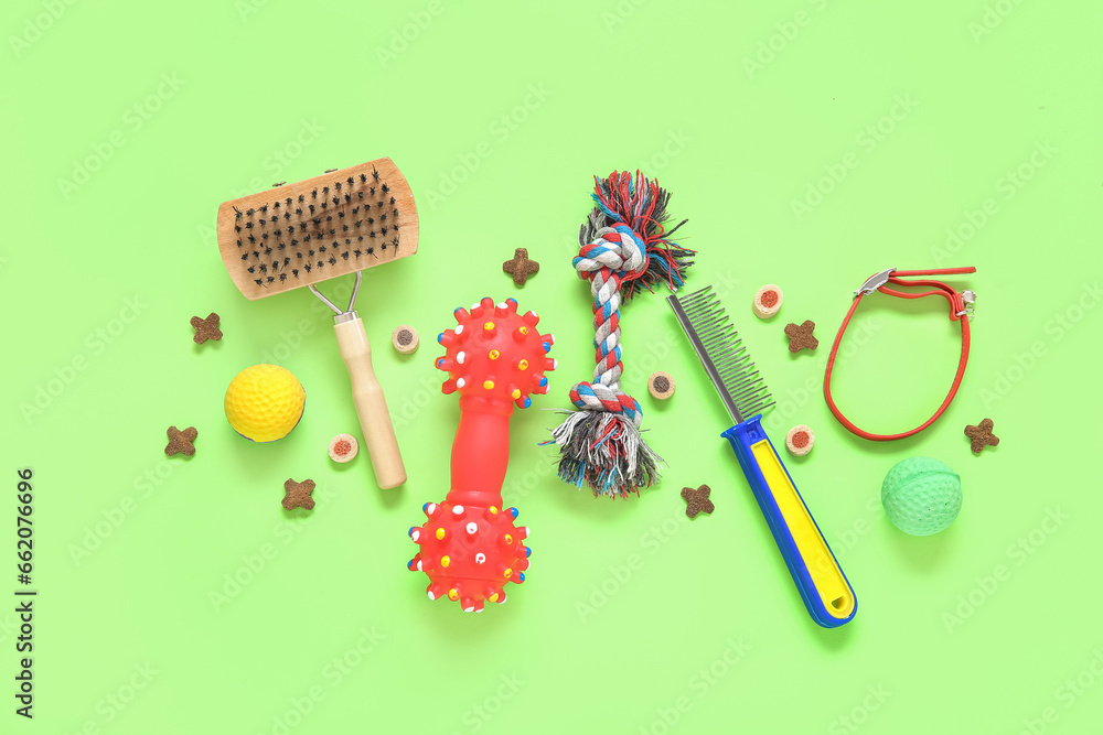 Composition with pet care accessories and food on green background