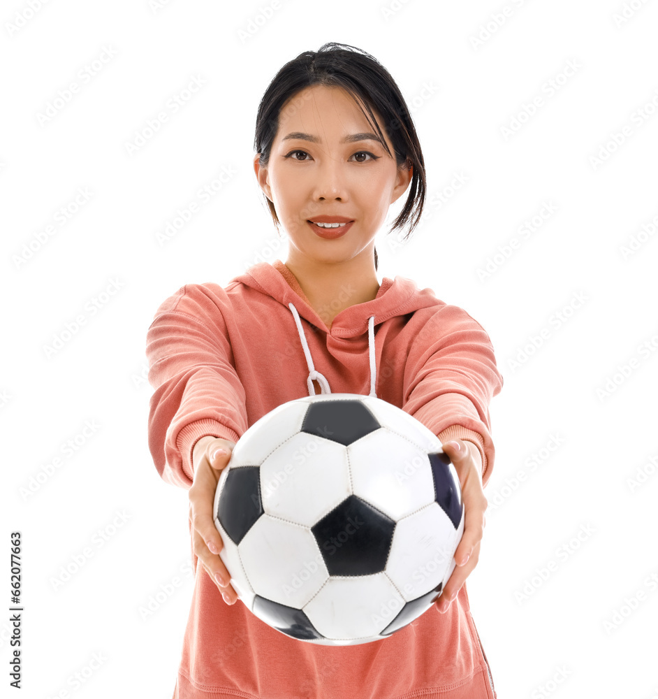 Happy beautiful Asian woman with soccer ball isolated on white background