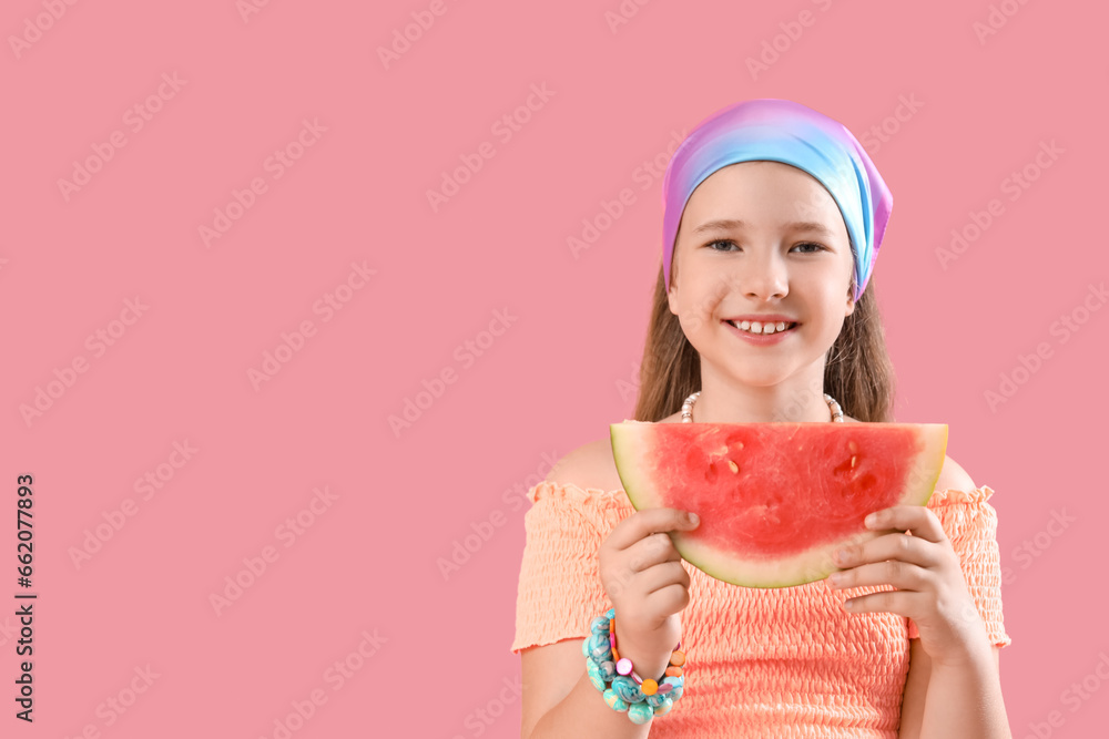 Happy little girl with slice of fresh watermelon on pink background