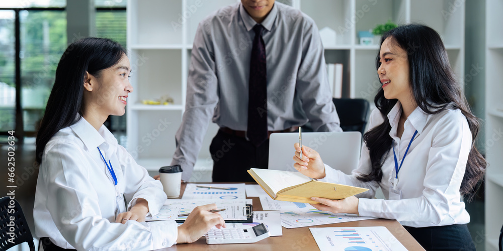 Business people teamwork with analysis cost graph on desk at meeting room