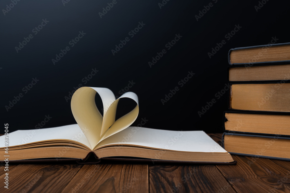 Book pages curved into heart shape