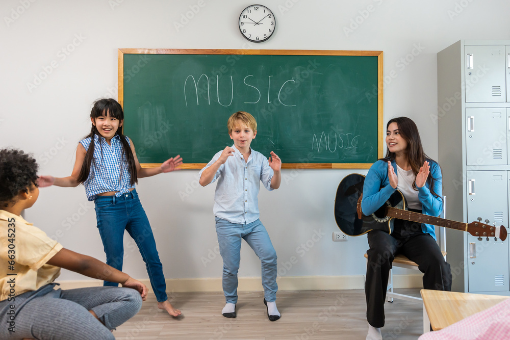 Group of student learn with teacher in classroom at elementary school. 